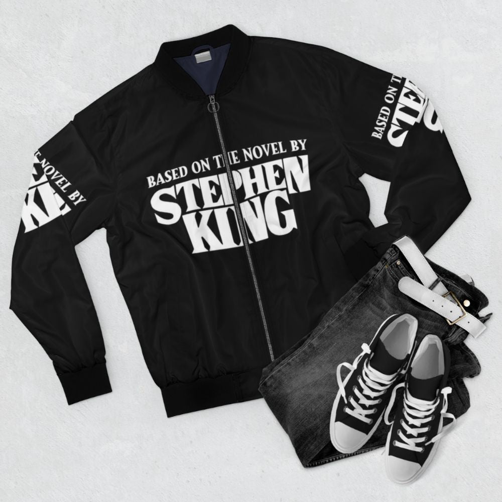 White bomber jacket inspired by Stephen King's horror novels - Flat lay