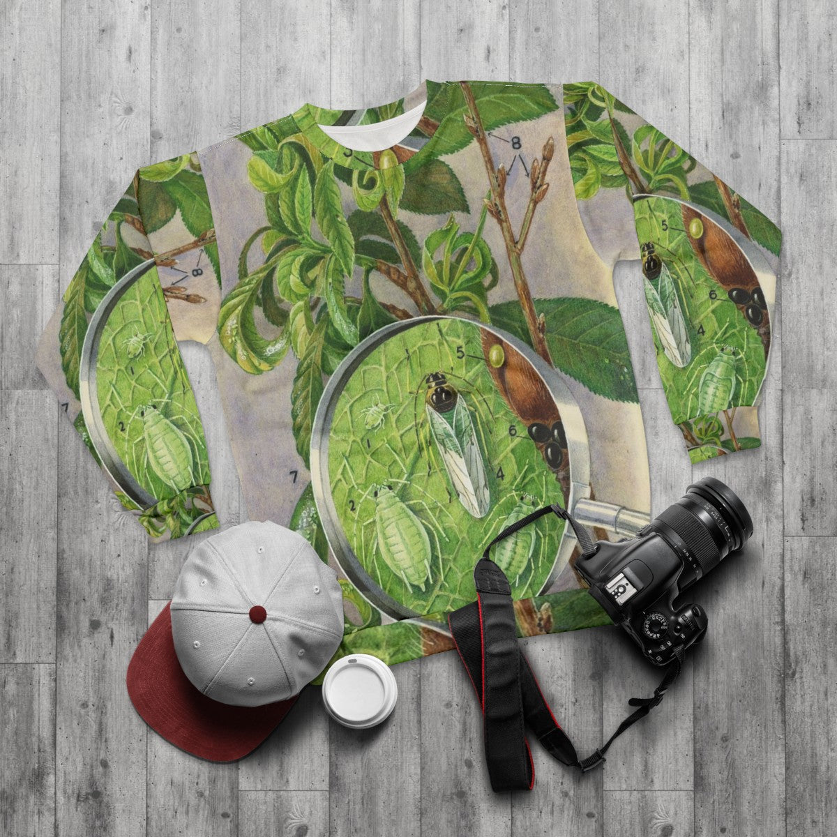 Green peach aphid botanical illustration on a sweatshirt - flat lay