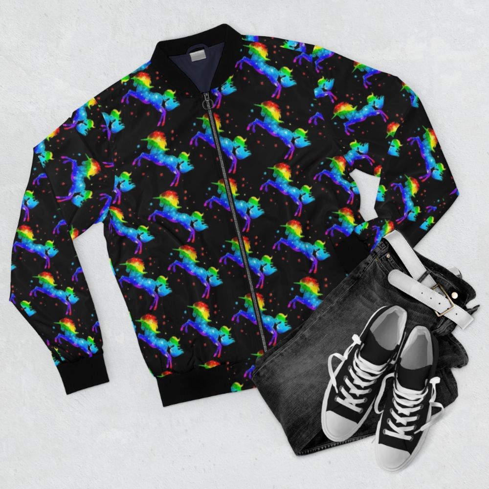 Galaxy unicorn bomber jacket with vibrant rainbow and cosmic star design - Flat lay