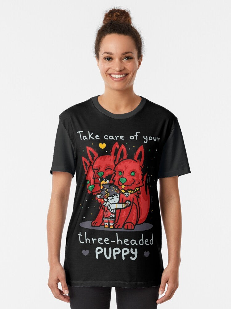 Graphic t-shirt featuring a cute three-headed puppy inspired by the Hades video game character Cerberus. - Women