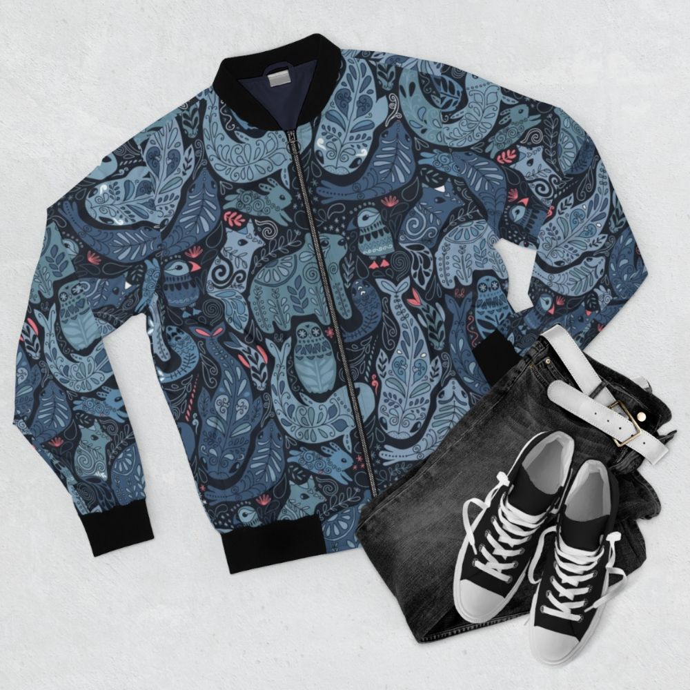 Bomber jacket with arctic animal designs including narwhal, polar bear, and seal - Flat lay