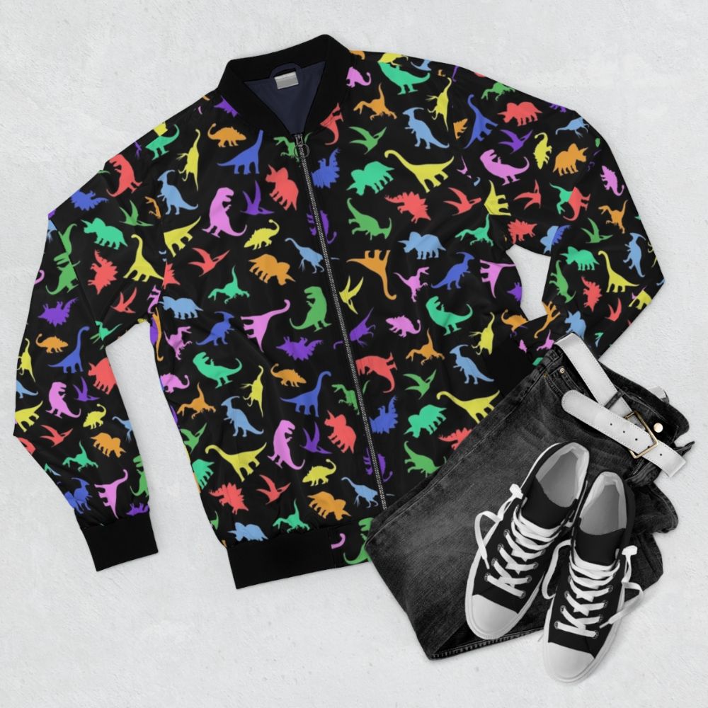 Dinosaur pattern bomber jacket with a black background - Flat lay