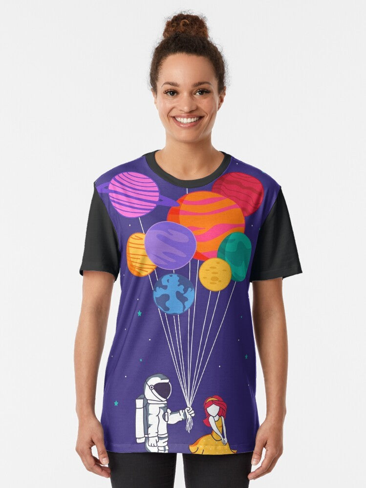 Graphic t-shirt featuring a couple in space with planets, stars, and a galaxy in the background - Women