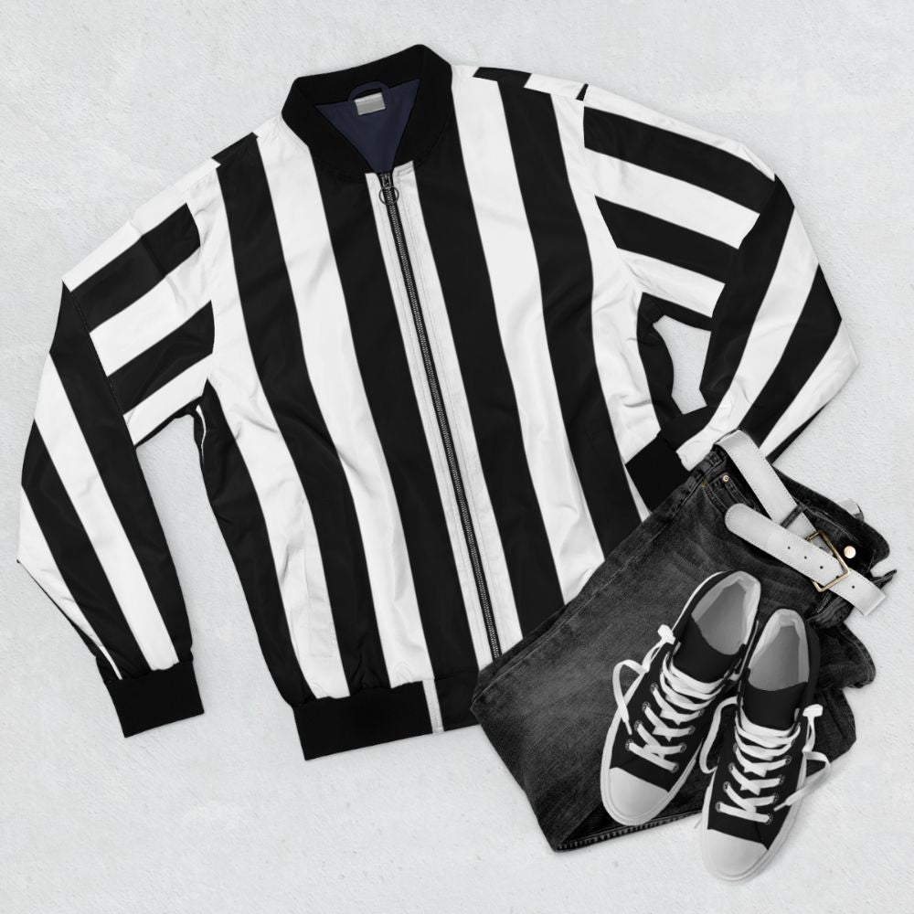 Black and white bomber jacket with vertical stripes and a vintage geometric pattern - Flat lay