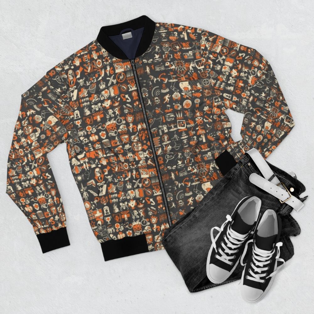 Team Fortress 2 inspired bomber jacket with a repeating achievement pattern design - Flat lay