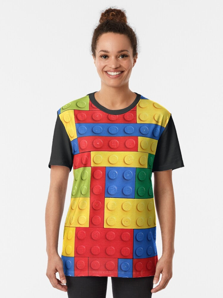 Colorful graphic t-shirt featuring a design of lego bricks in various colors and patterns - Women