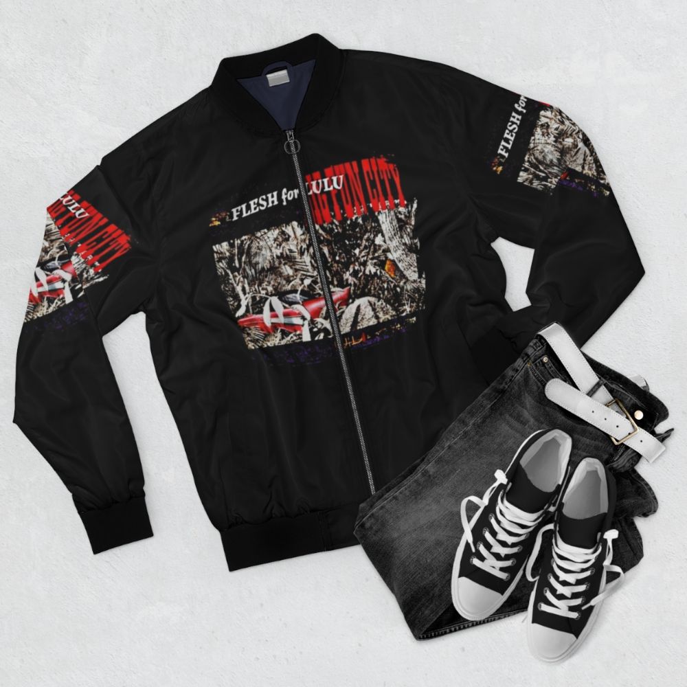 Goth and punk inspired bomber jacket with dark colors and edgy designs - Flat lay