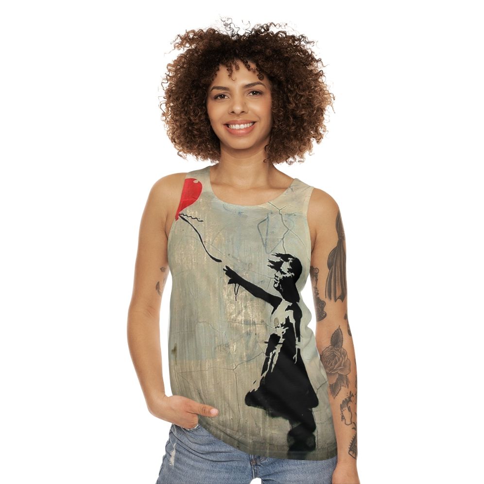 Banksy-inspired red tank top with heart balloon graphic - women