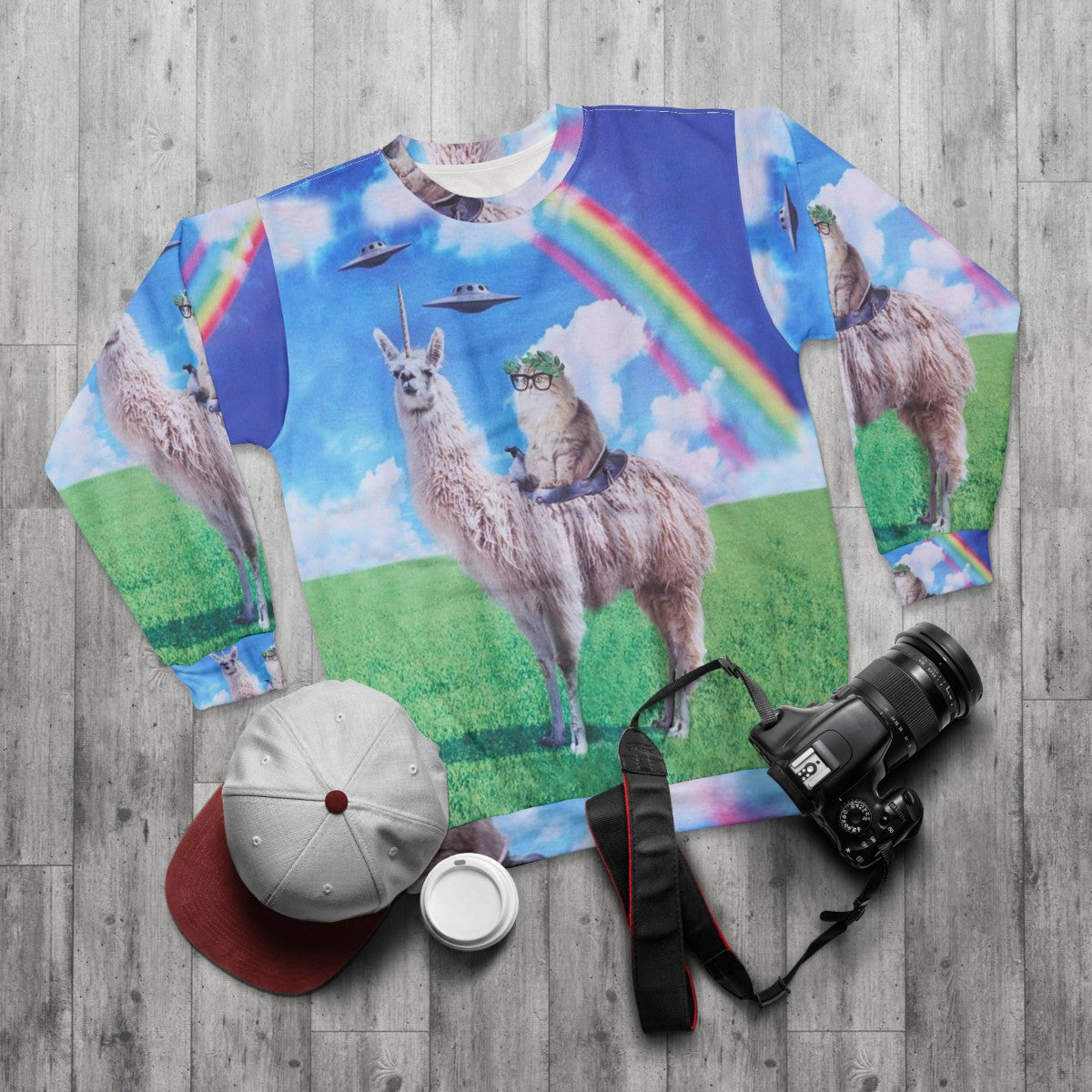 Cosmic cat riding llama unicorn rainbow UFO graphic sweatshirt - flat lay