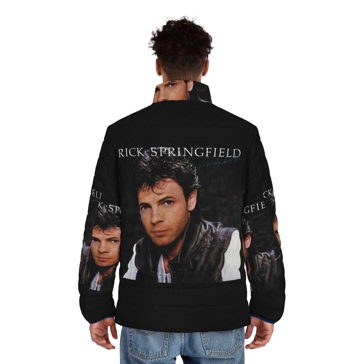 Rick Springfield wearing a puffer jacket featuring the "Living in Oz" album cover art - men back