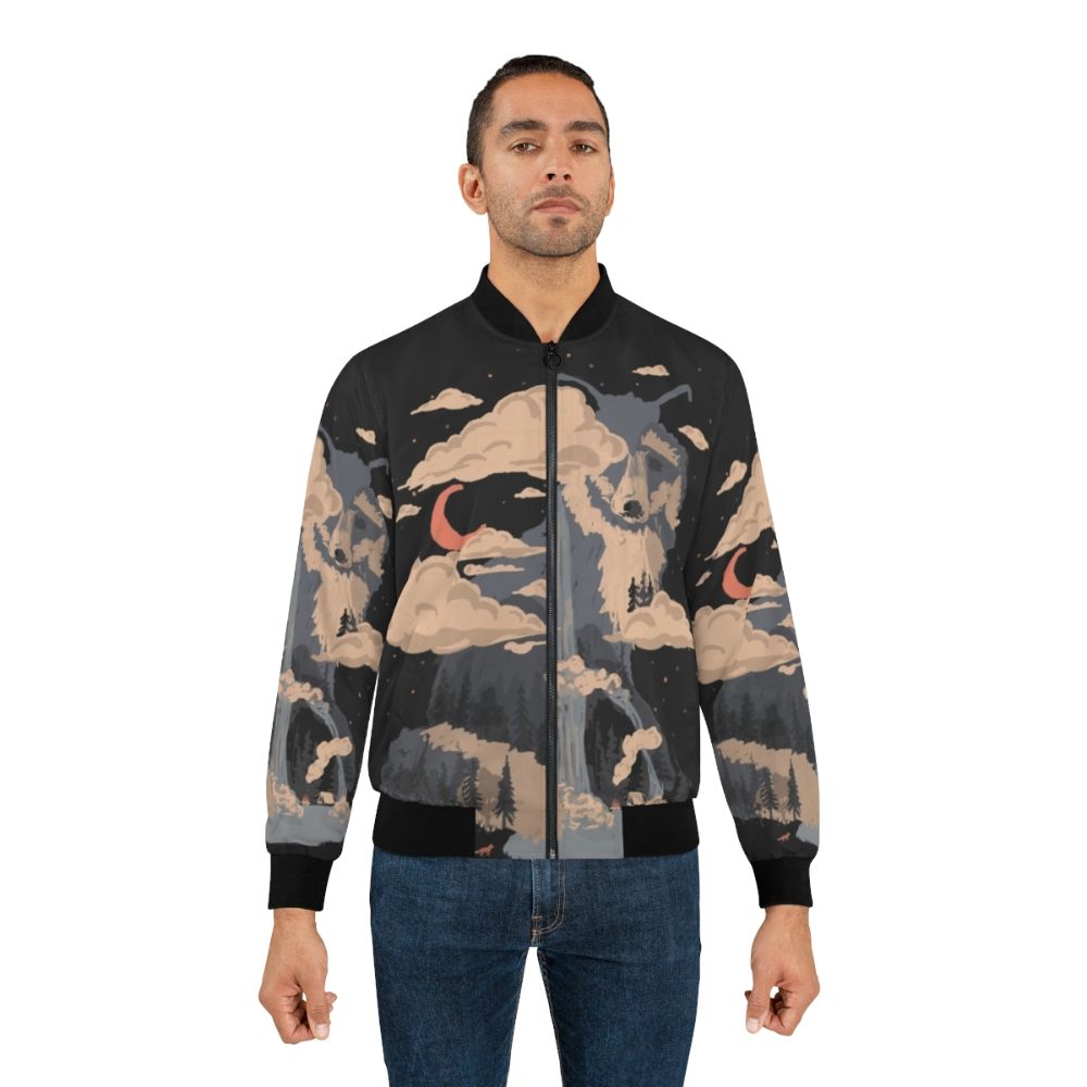 A bomber jacket featuring a nature-inspired design with mountains, wildlife, and a waterfall. - Lifestyle