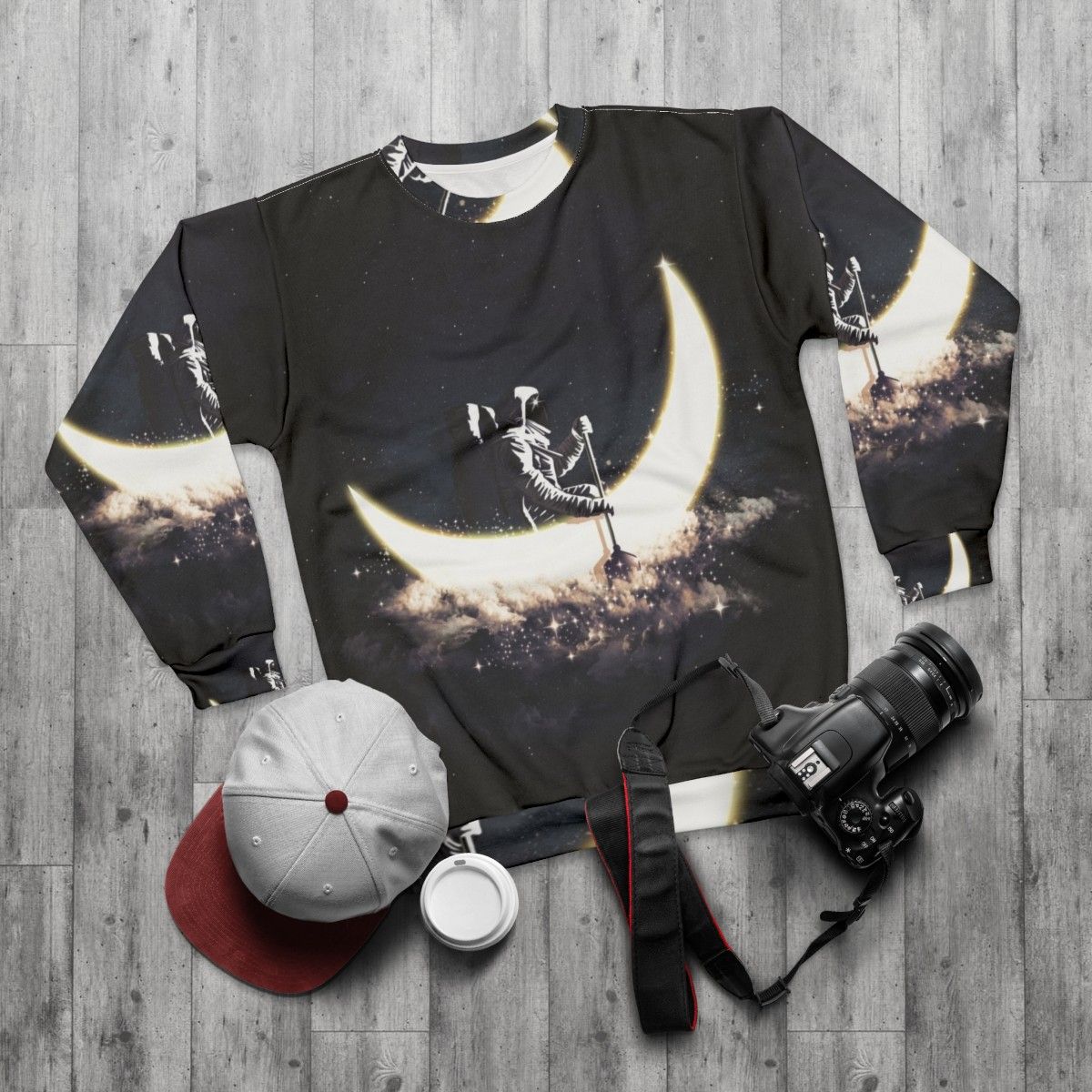 Cosmic Moon Sailing Sweatshirt featuring an abstract space and astronaut design - flat lay