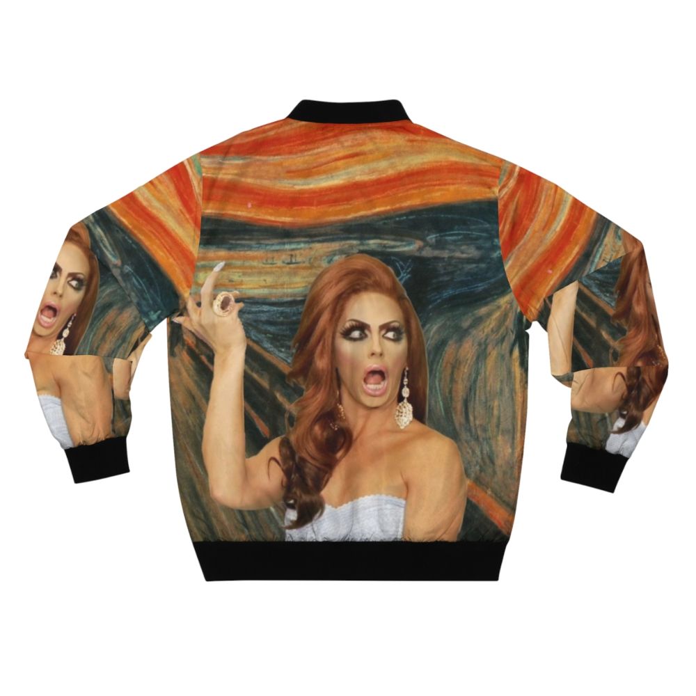 Alyssa Edwards wearing a colorful bomber jacket with her iconic catchphrase "Backrolls?" printed on the back - Back