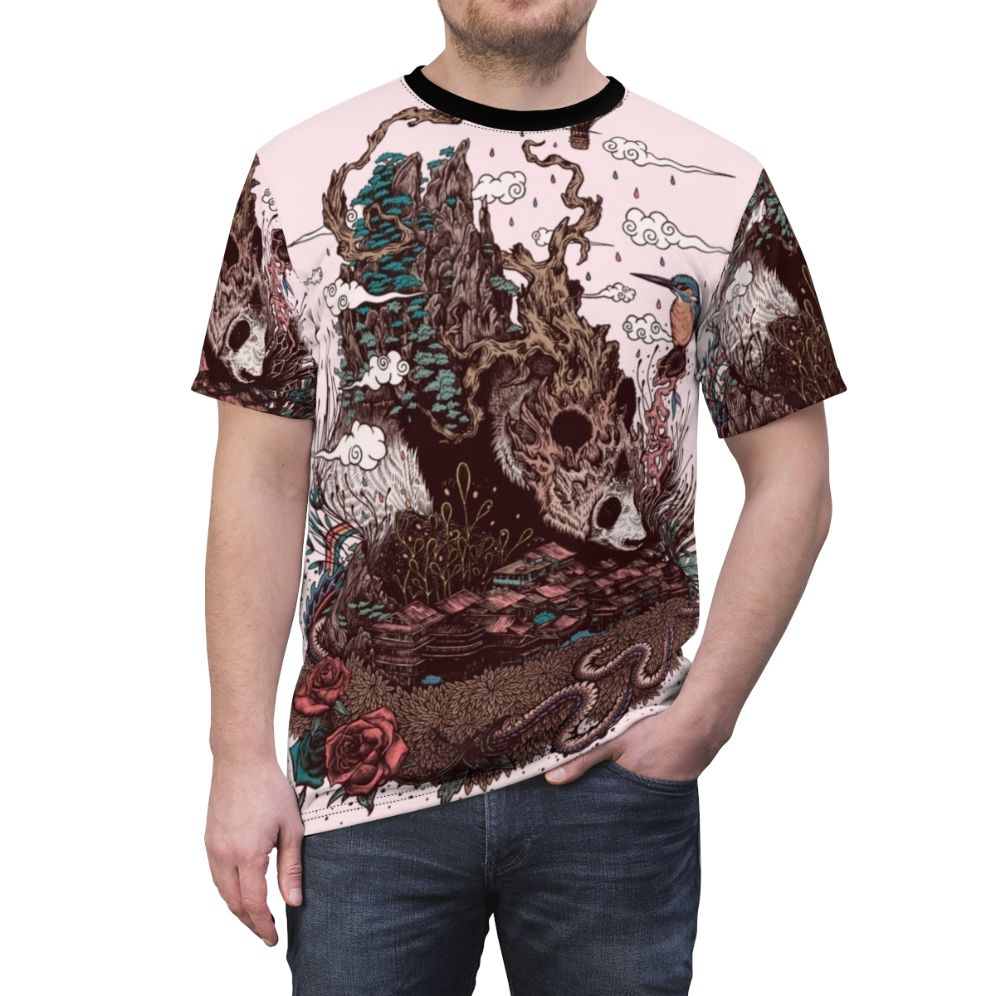 Closeup of a detailed nature illustration design featuring a panda bear, mountains, autumn leaves, and other natural elements on an all-over print t-shirt. - men front