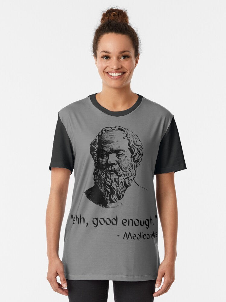 A graphic t-shirt featuring the text "Mediocretes Philosophy" in a vintage-inspired design, representing the philosophy of Socrates and ancient Greek thinkers. - Women