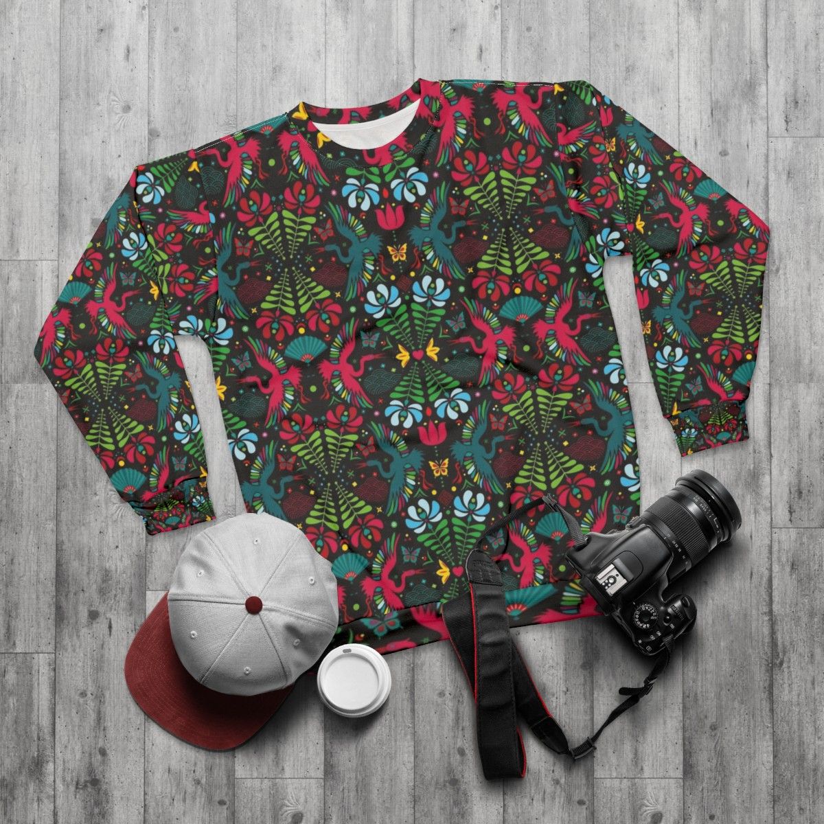 Colorful folk art crane pattern sweatshirt - flat lay