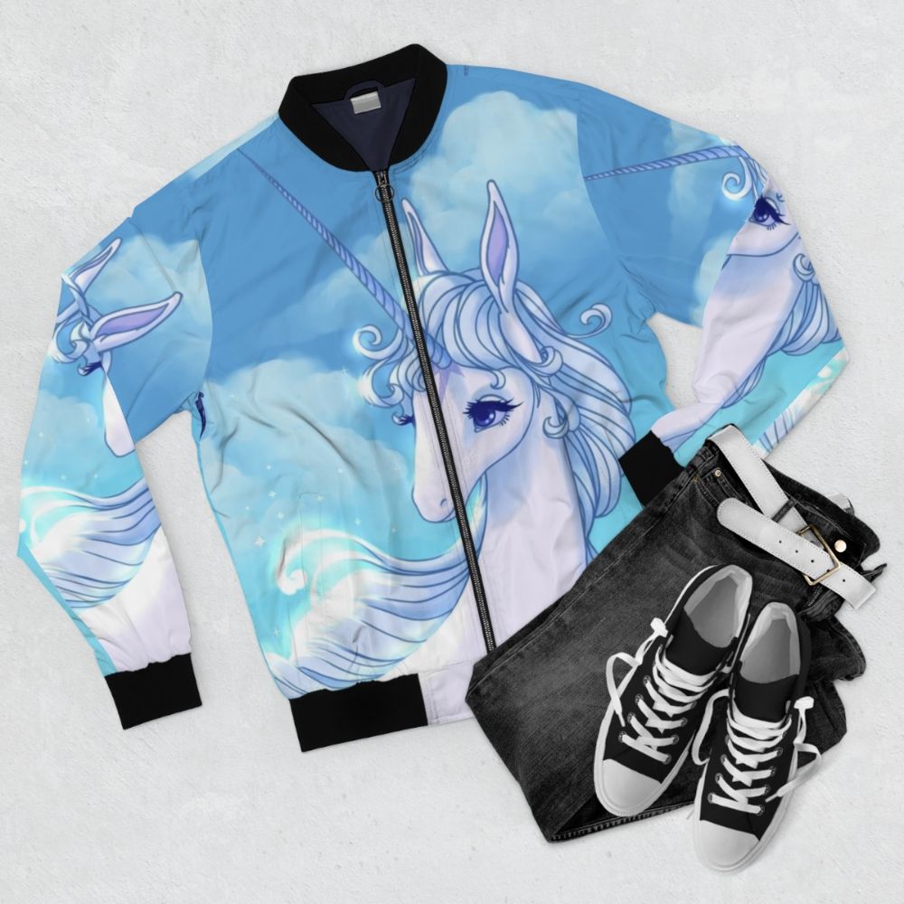 The Last Unicorn bomber jacket with unicorn, lady amalthea, and retro 80s movie graphics - Flat lay