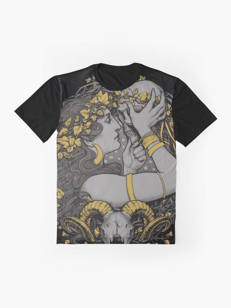 A gothic graphic t-shirt featuring a witch design with a ram skull, human skull, and botanical elements - Flat lay