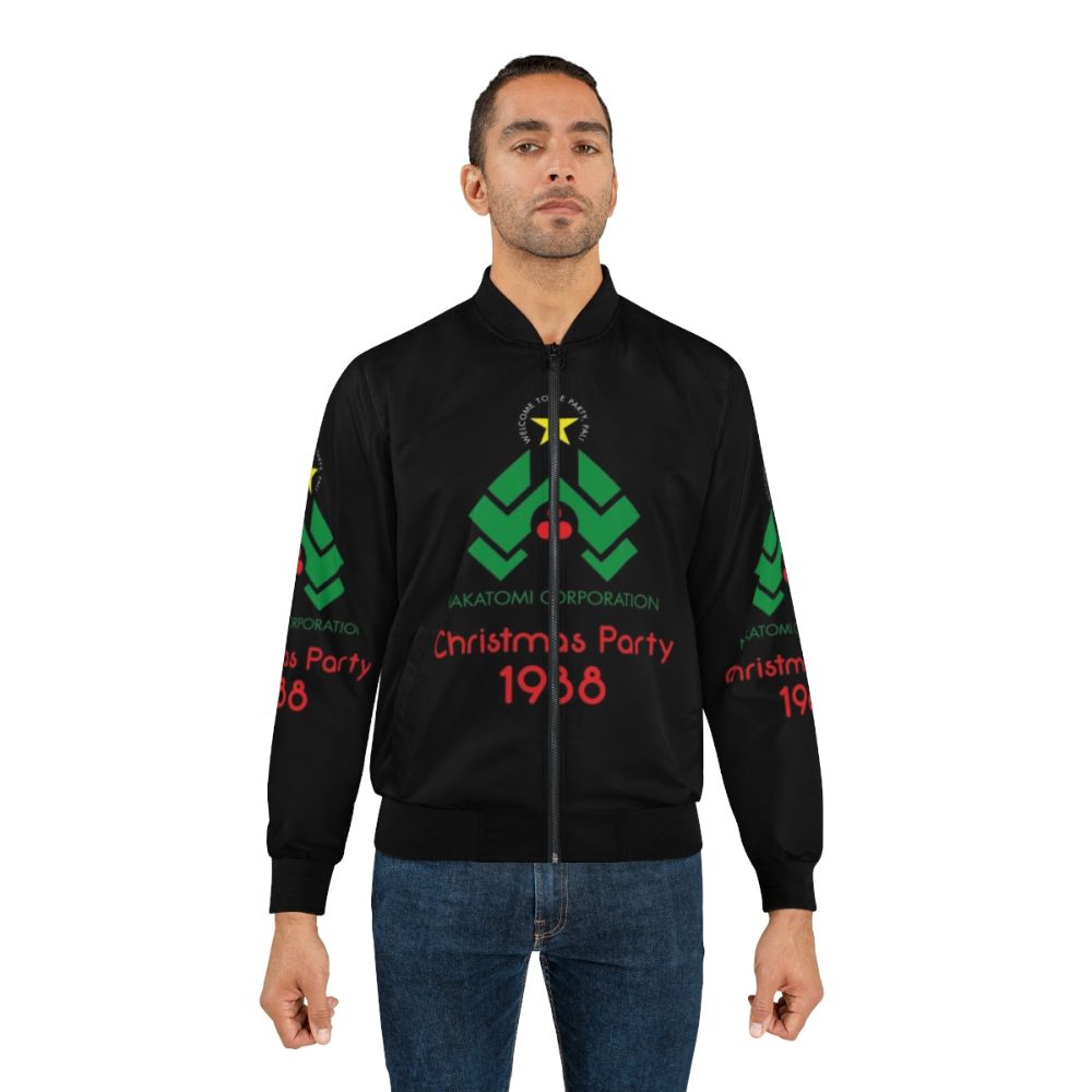 A stylish bomber jacket featuring the Die Hard movie logo, Christmas tree, and "Yippee ki yay" quote. - Lifestyle