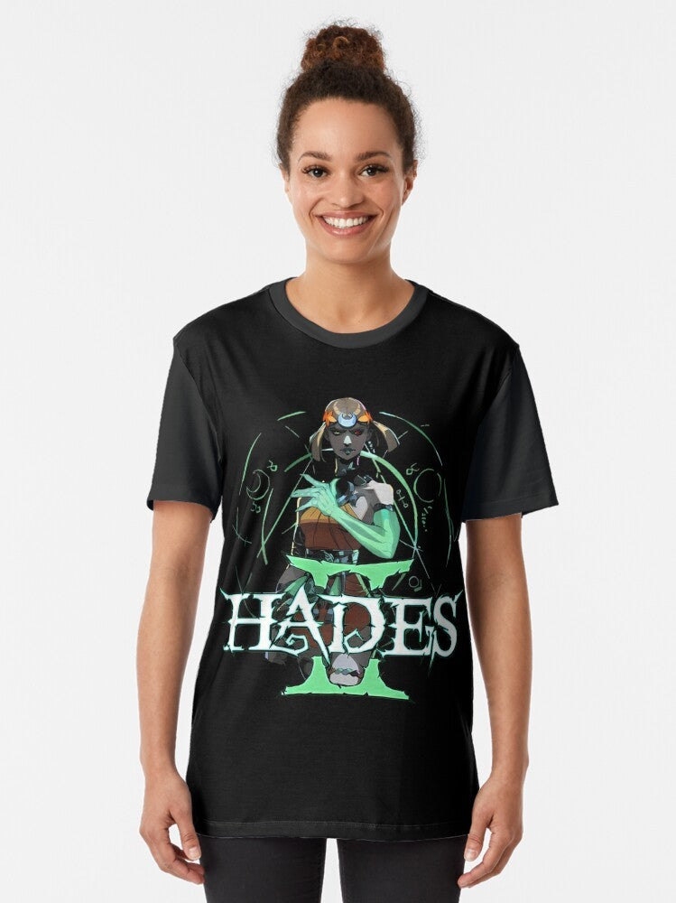 Hades II Melinoe Graphic T-Shirt featuring the logo and characters from the popular Greek mythology-inspired roguelike game - Women