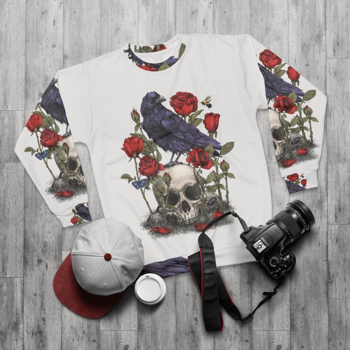 Memento Mori Sweatshirt with Raven, Skull, and Floral Graphic - flat lay