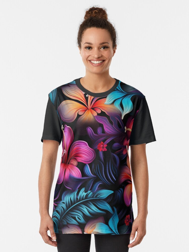 A graphic t-shirt featuring a tropical Hawaiian-inspired pattern with bioluminescent flowers and plants. - Women