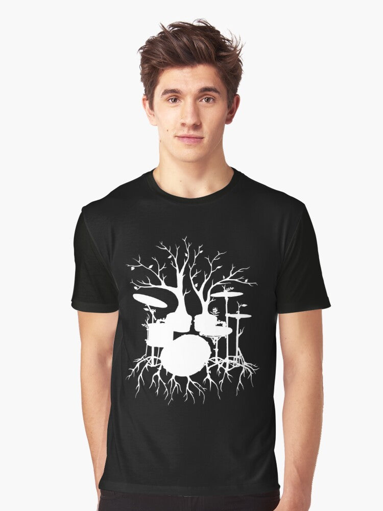 Surreal graphic t-shirt design featuring a silhouetted drum tree, symbolizing the connection between music and the natural world. - Men