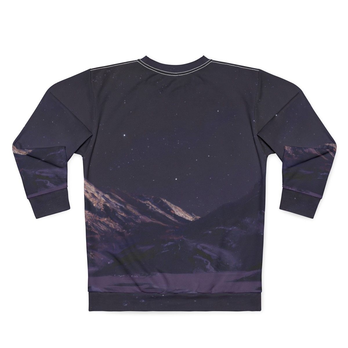 A person wearing a sweatshirt featuring a design of mountains against a night sky filled with stars. - Back