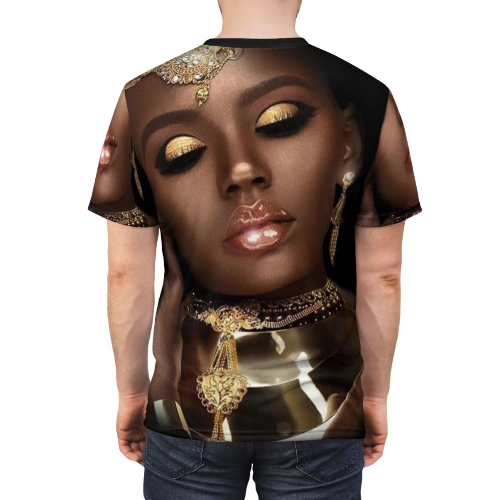 A vibrant and artistic t-shirt design featuring the face of an African queen or goddess with abstract patterns, jewelry, and cultural elements. - men back