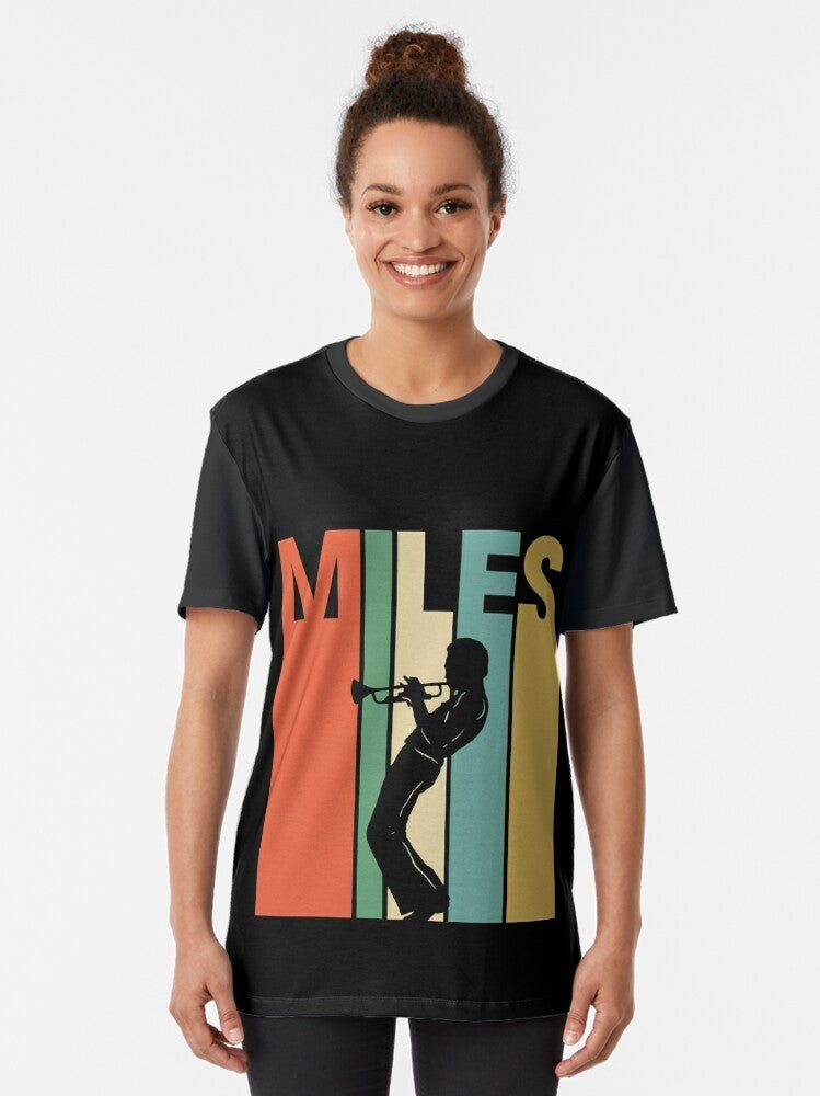 Retro graphic t-shirt featuring a blue trumpet with the words "Miles Davis" in a vintage-inspired design. - Women