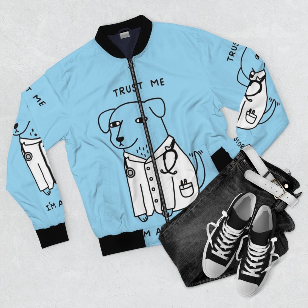 Cute bomber jacket with a pun design featuring a dog wearing a stethoscope, representing a "dogtor" or veterinarian. - Flat lay