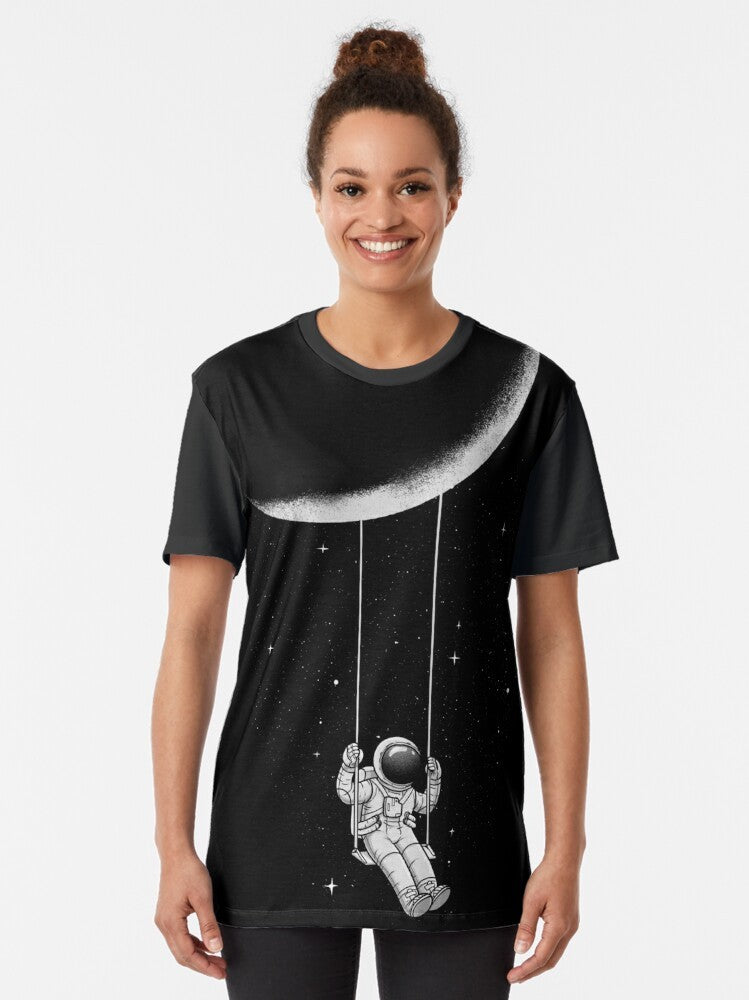 A surrealist black and white graphic t-shirt with an abstract moon swing design - Women