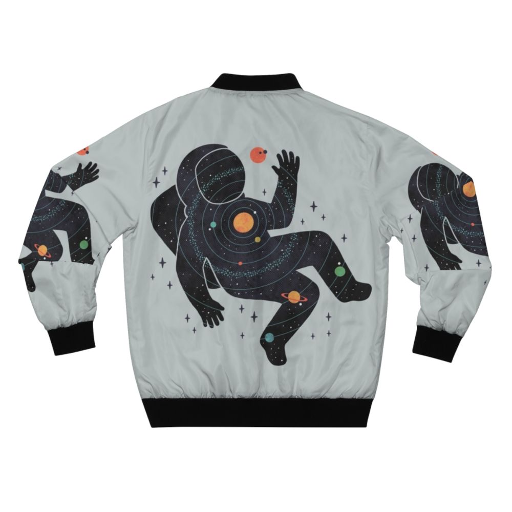 A minimalist bomber jacket featuring a space-inspired design with planets, stars, and cosmic elements. - Back