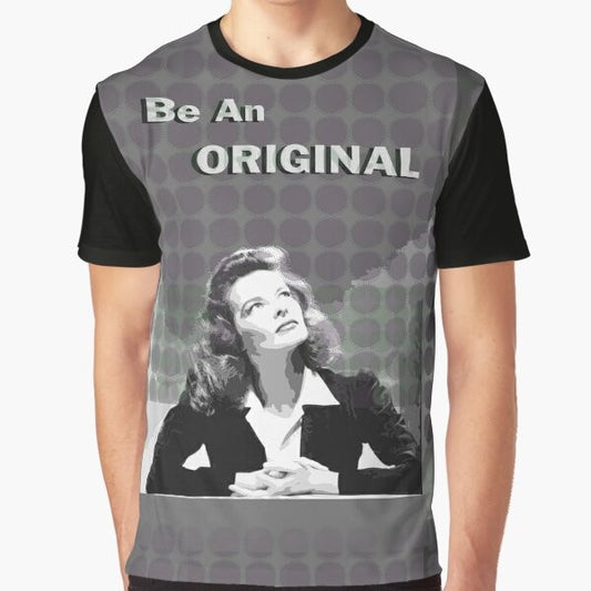 Graphic t-shirt with a portrait illustration of Katharine Hepburn, a famous movie star known for her iconic fashion style and trouser suits.