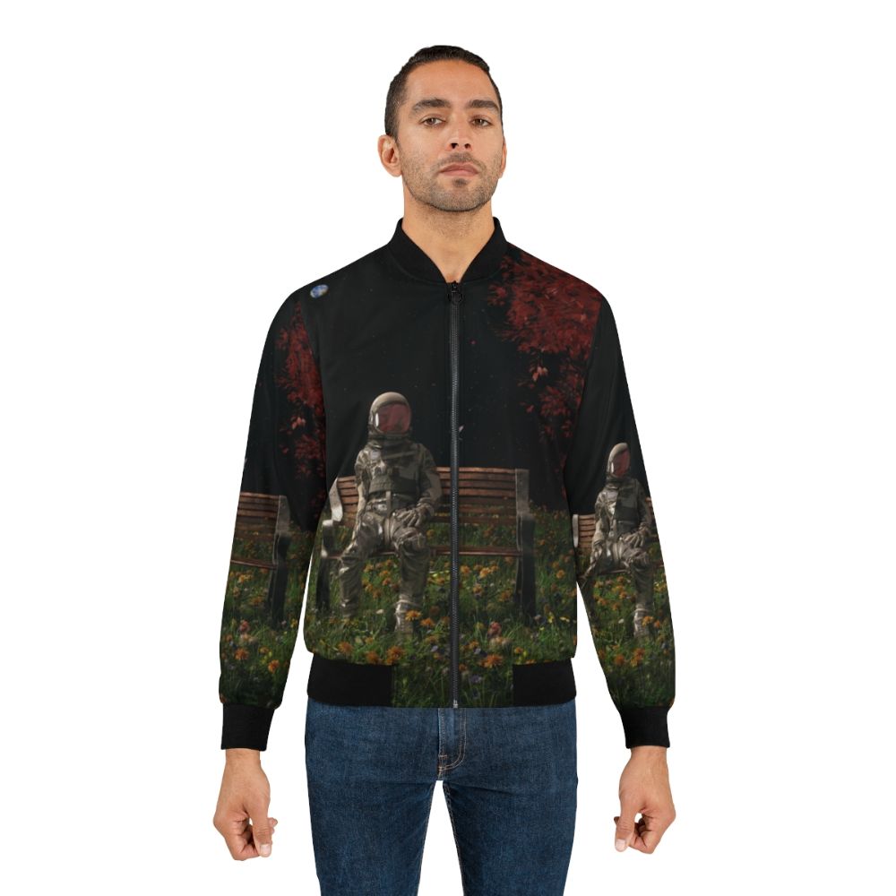 Interlude Cosmic Bomber Jacket with surreal, space-inspired design featuring astronauts, birds, and flowers - Lifestyle