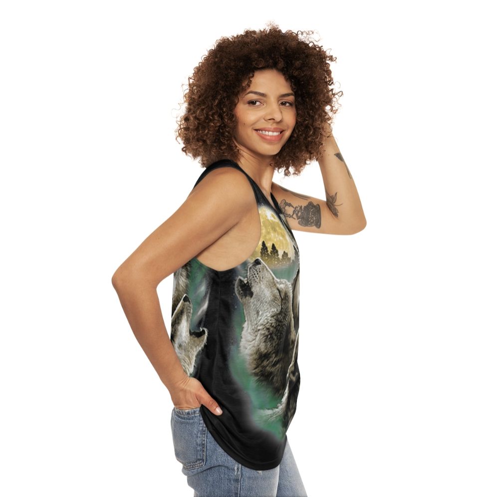 Unisex tank top with three wolves howling at the full moon in the wilderness - women side