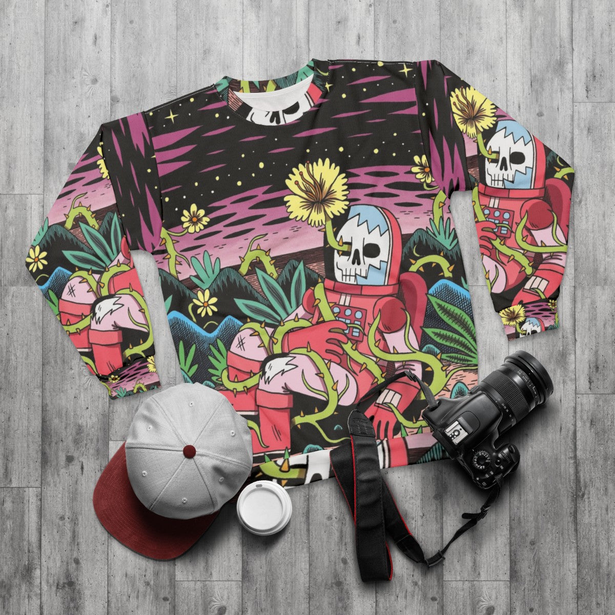 Flower pattern sweatshirt with cosmic, space-inspired design - flat lay