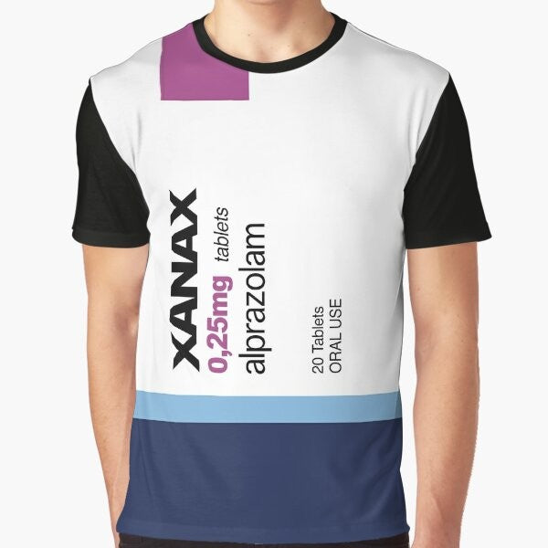 A graphic t-shirt featuring the word "XANAX" in a bold, stylized font, surrounded by various meme-inspired elements like rainbows, pods, and avocados.