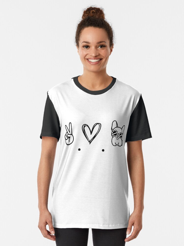 Minimalist graphic t-shirt design featuring a French bulldog with the text "Peace, Love and Frenchies" - Women