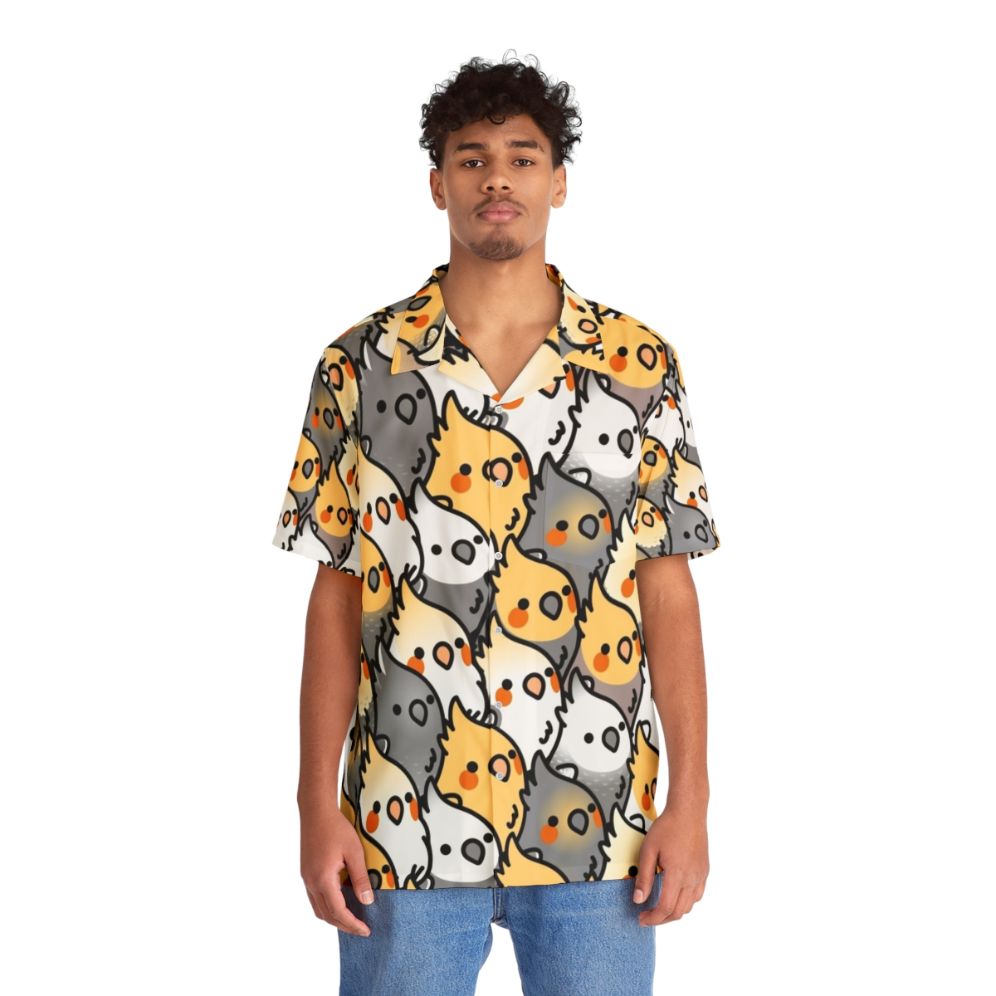 Chubby cockatiel wearing a vibrant Hawaiian shirt with a tropical bird pattern - People Front