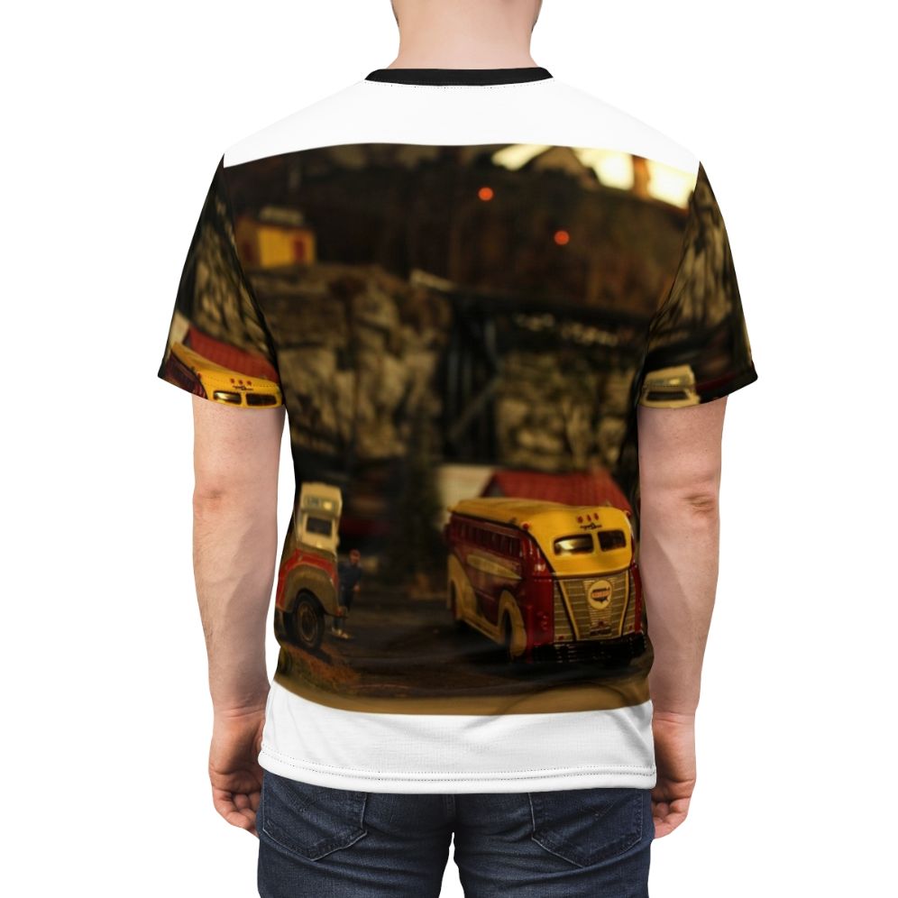 Man wearing a t-shirt with a detailed design of a model train locomotive and tracks - men back