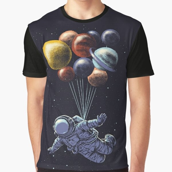 Space travel graphic t-shirt featuring a colorful, surrealist design of the solar system and cosmic elements