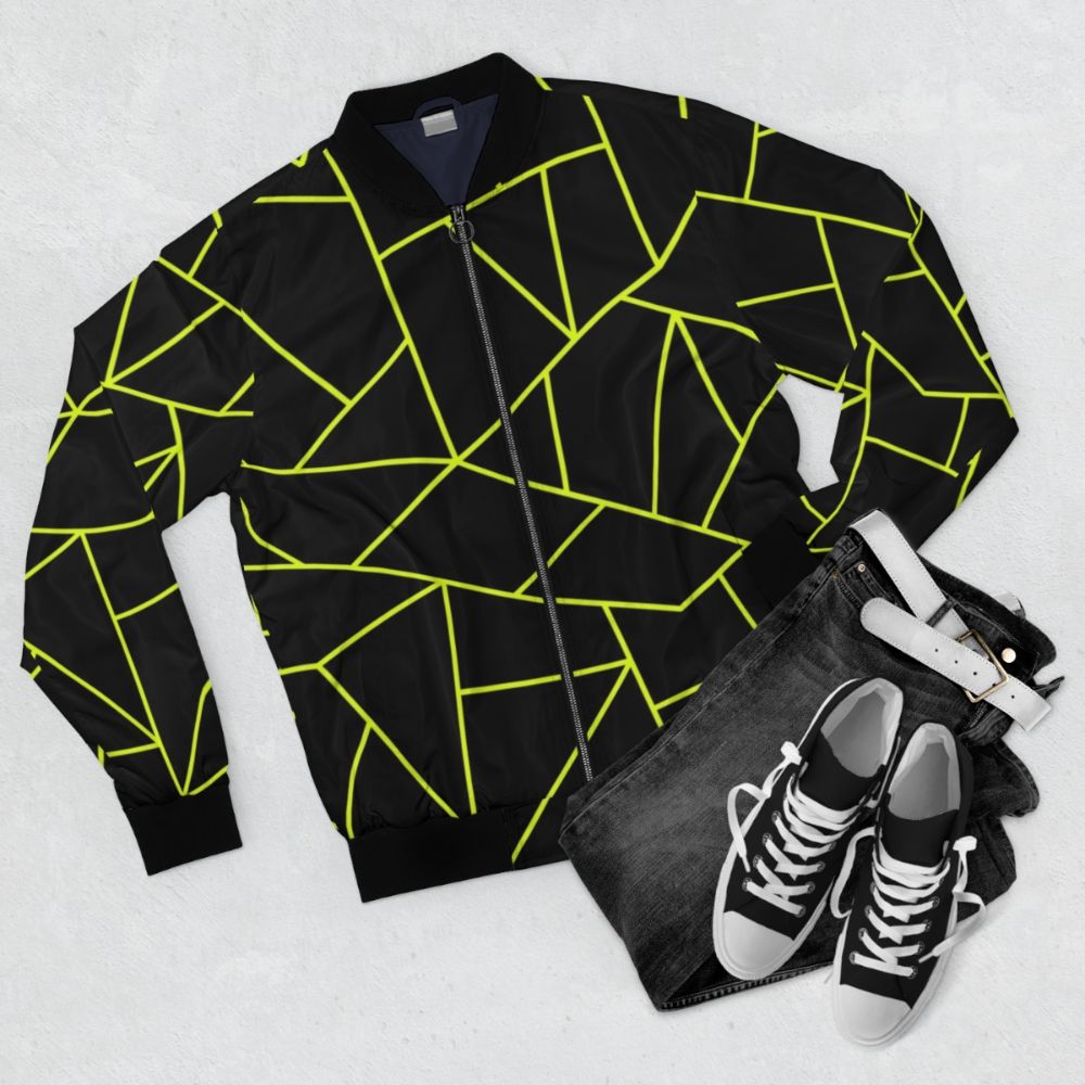 Chartreuse yellow and black bomber jacket with a unique geometric pattern design - Flat lay