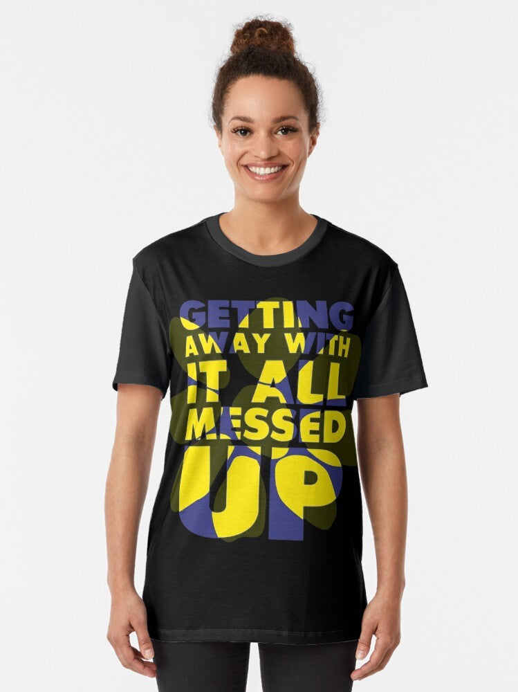 "Getting Away With It" graphic t-shirt featuring the James band logo in blue and yellow colors - Women